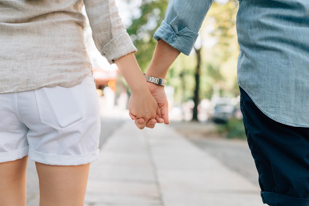 Two people holding hand