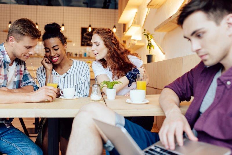 Friends sitting down at a table