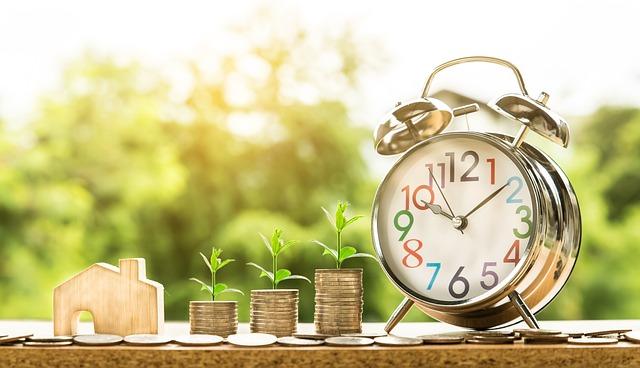 A clock and money on a table