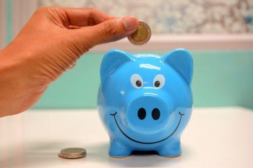 Blue piggy bank for saving money to buy a property