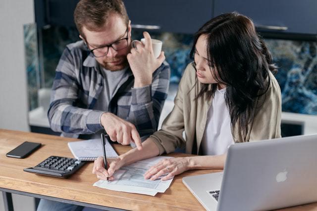 A couple looking at financial documents
