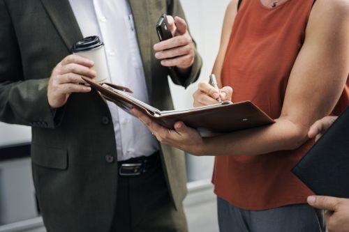 A man and a women looking at important documents