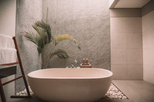 Modern bathtub in a grey bathroom