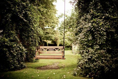 Wooden swing in a garden