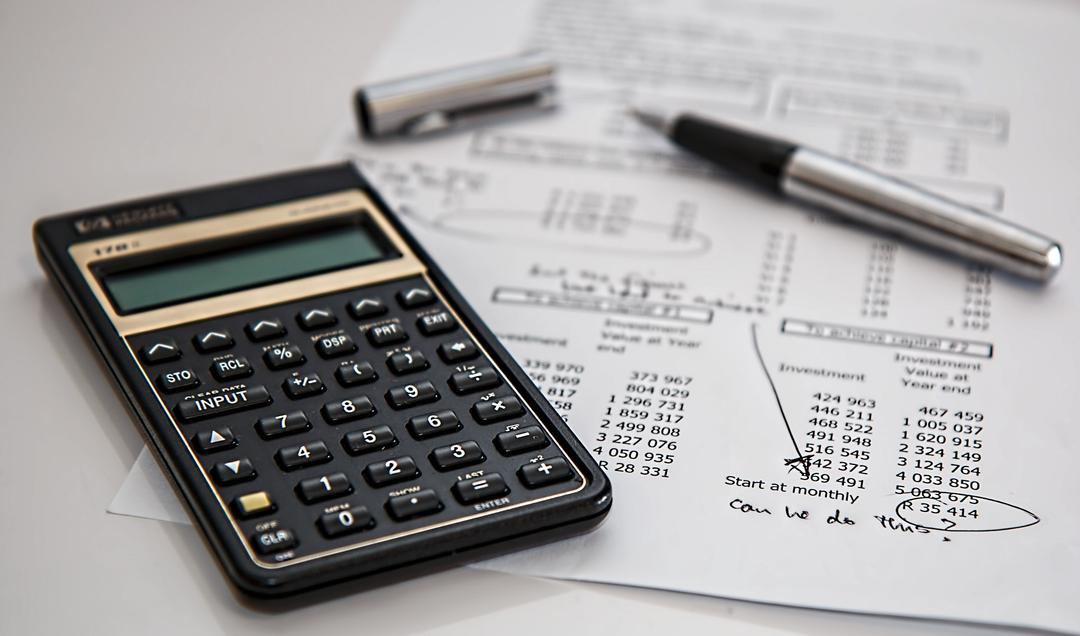 A calculator and some financial documents