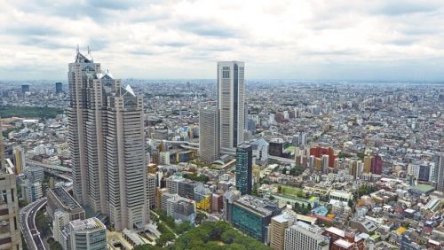 Illustration d'une vue aérienne d'un centre-ville comprenant des gratte-ciel