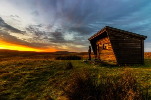 A tiny house at sunset