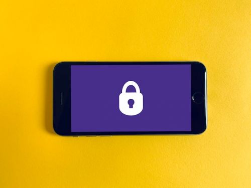 White lock on a purple cellphone background