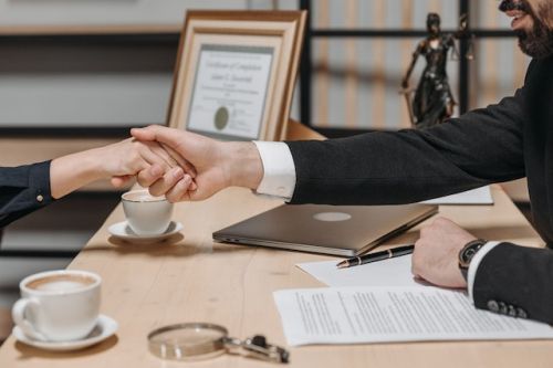 Notary shaking hands with a client