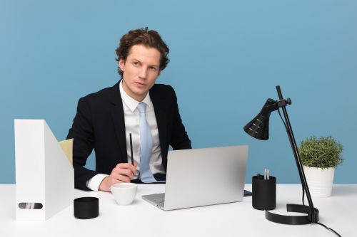 Certified appraiser thinking at his desk