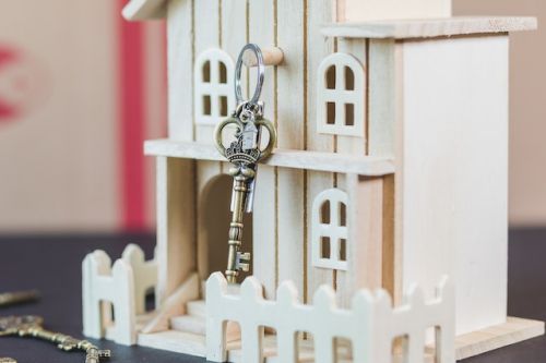 Small wooden house with a key