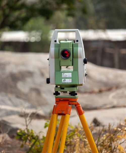 A land surveyor use many tools and equipments