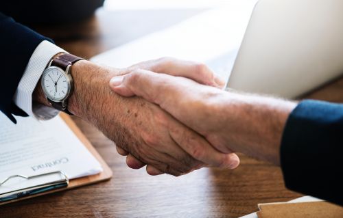 The mortgage broker shaking hand with a client